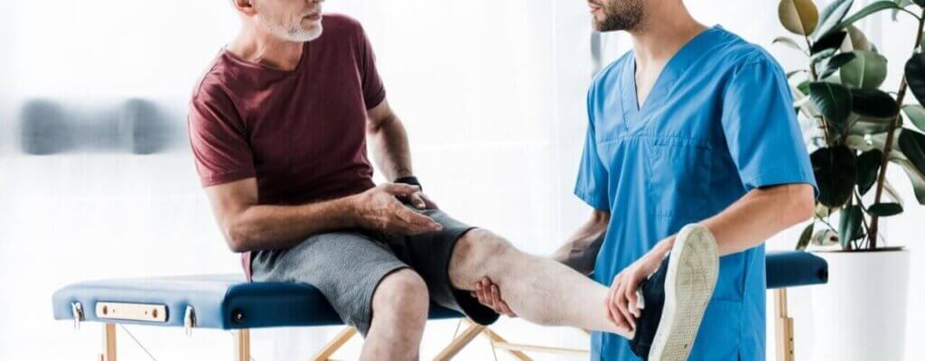 A doctor checking for any leg pain